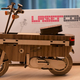 Illustration for article titled Buy The Hell Out Of This Awesome Little Laser-Cut Wooden Honda Motocompo Model